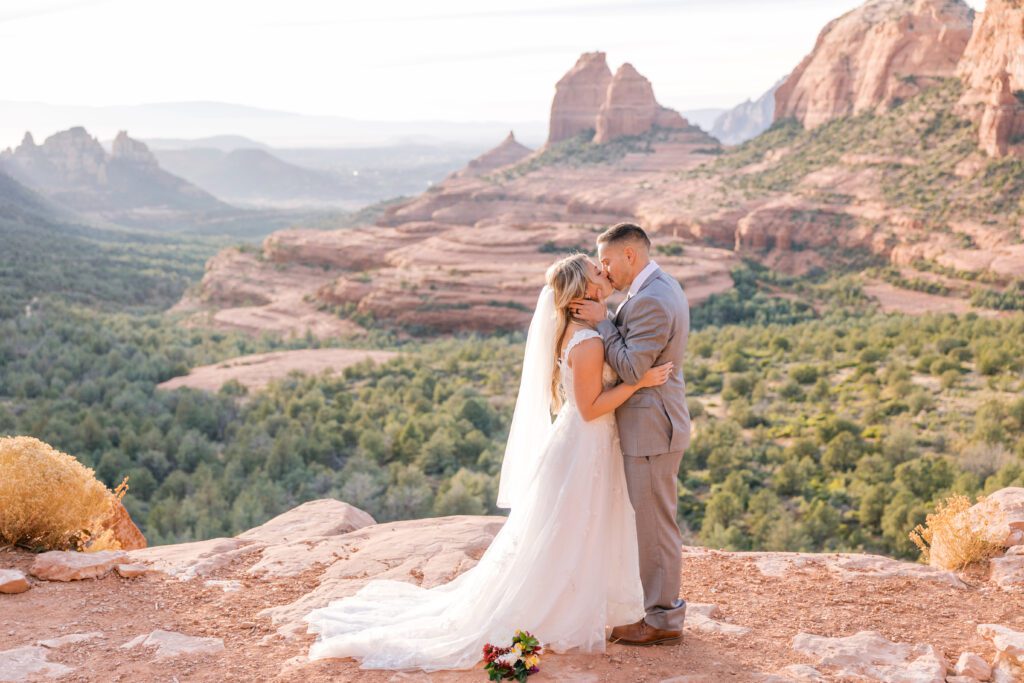 First kiss as husband and wife for a couple that eloped in Sedona 
